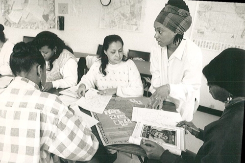 Students with teacher Iesha Sekou working on a project about Africa in 1995